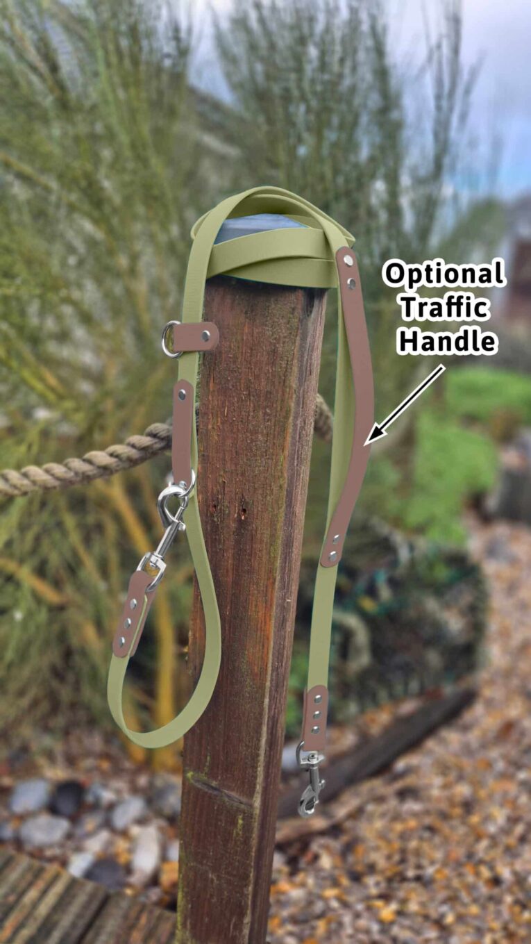Avocado-coloured BioThane multi-way double-ended lead with optional traffic handle and brown BioThane accents, displayed on wooden post.