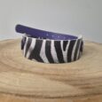 Zebra-striped printed tapered hound collar in black and white with navy BioThane backing and hardware.