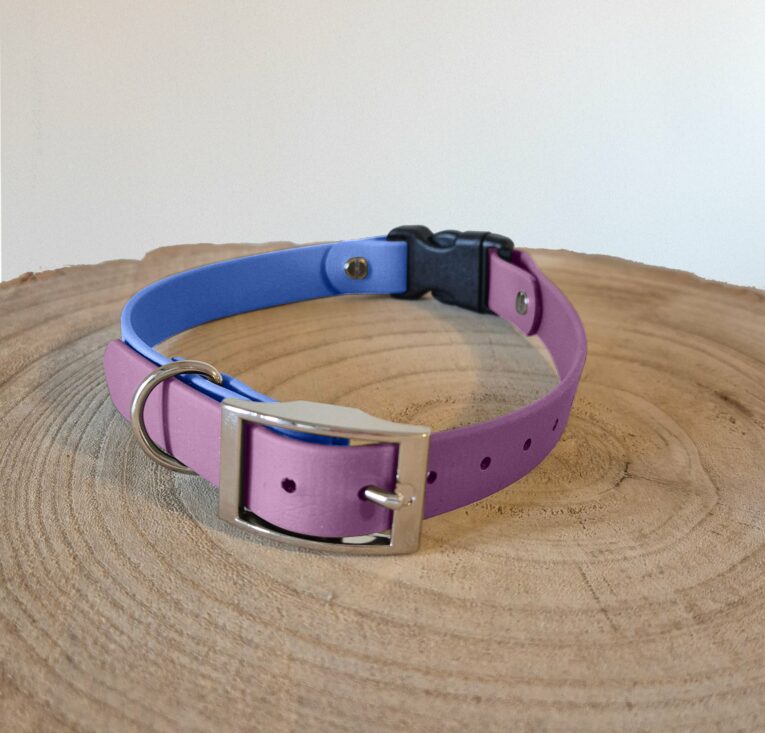 Purple and blue BioThane quick-snap customisable dog collar strap with nickel hardware displayed on wooden surface.