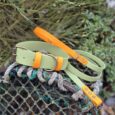 Pale green extra wide BioThane collar with orange accents and matching lead on weathered rope.