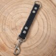 Black super-grip waterproof grab tab handle with nickel hardware on wooden background.