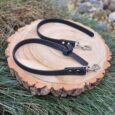 Black Super-Grip Waterproof Training Tab Obedience Lead with textured grip finish and nickel hardware, displayed on wood.