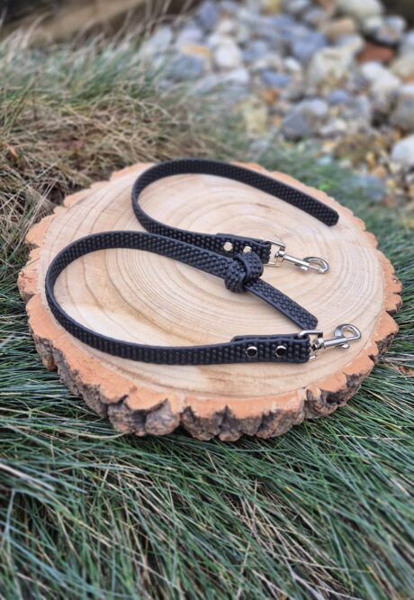 Black Super-Grip Waterproof Training Tab Obedience Lead with textured grip finish and nickel hardware, displayed on wood.