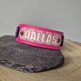 Pink printed double layer hound collar with floral design and brass hardware, displayed on stone.