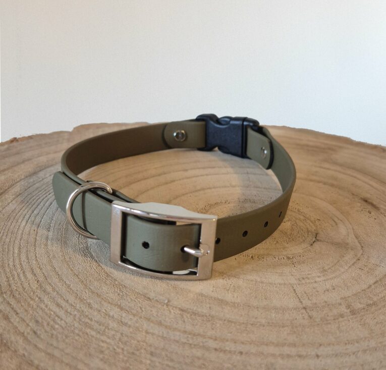 Waterproof BioThane quick-snap customisable dog collar strap with nickel hardware, displayed on natural wood.