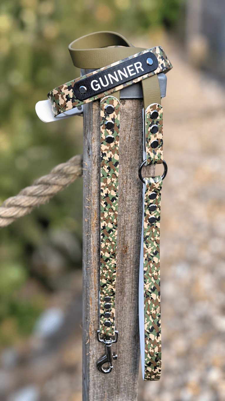 Camouflage printed BioThane lead with tan handle, displaying gunner branding and metal hardware detail.