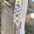 Floral printed BioThane lead with colourful daisy design and antique brass hardware detail.